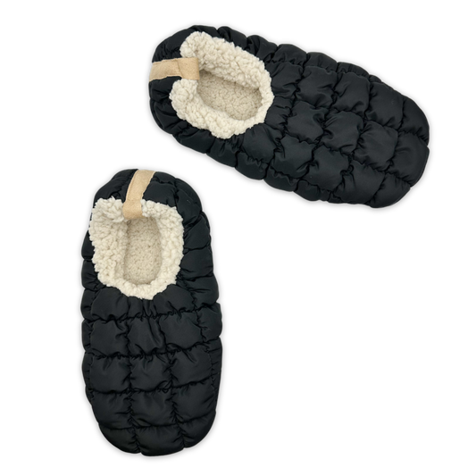 black slipper with beige pull tab on back