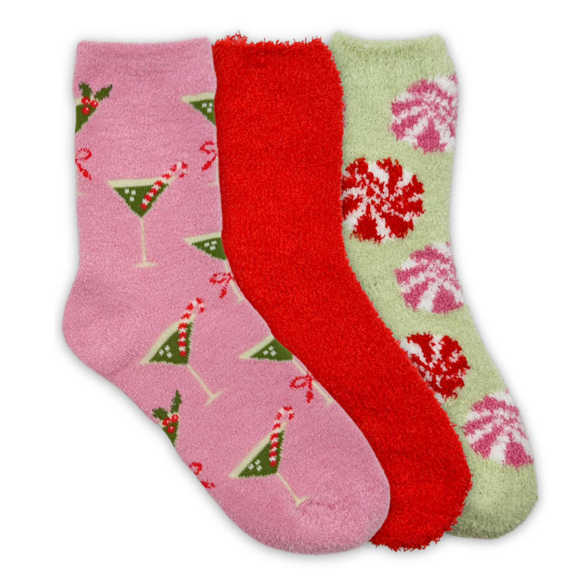 three fuzzy socks: a pink sock with green martinis and pink bows, a plain red sock, and a green sock with pink and red peppermints