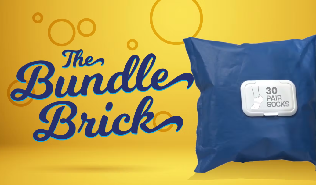 Load video: Introducing the Bundle Brick: a convenient, take anywhere and everywhere portable sock drawer with 30 pairs of socks. When you&#39;re on the go, the bundle brick allows you to have a clean pair of socks ready for any occasion: after workouts, in your car, at the playground, summer camp, on vacation, in your dorm room, in the classroom. A compact, easy to store solution for wherever life takes you. The grab and go bundle brick, 30 pairs of socks housed in a familiar, convenient, and modern package. Gender neutral, pop top package, easy open and close! The bundle brick offers an incredible value for this key wardrobe essential: time saving and fewer laundry cycles. Live your life! The bundle brick: you&#39;ll wonder how you ever lived without it!