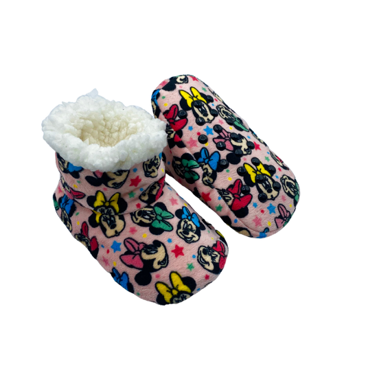 One pair of pink bootie featuring a pattern of Minnie Mouse faces wearing colorful bows. The inside filled with our light beige signature Babba material. The foam bottom is covered in Safety Dots™ non-slip grippers.