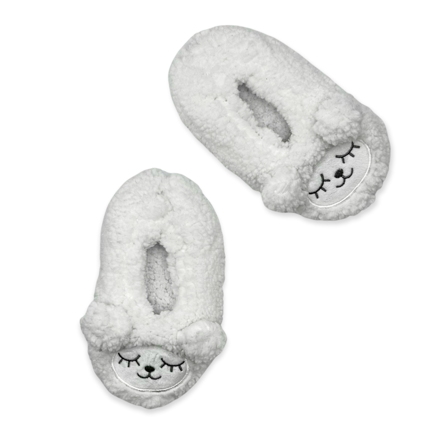  A pair of white slippers with a sheep face on them