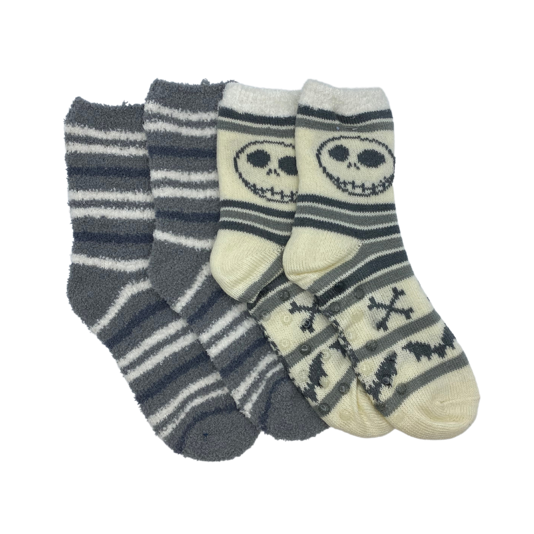 Two pairs of socks inspired by the Nightmare before Christmas.

One is a grey sock with black and white stripes.

The other is a white sock featuring black stripes, a motif of Jack Skellington above the ankle, and bats and bones on the lower part.