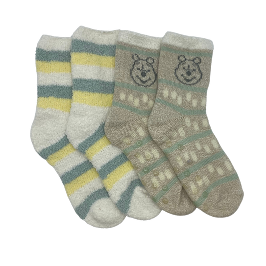 Two pairs of socks inspired by Winnie the Pooh.

One features white, yellow, and green strips.

The other features a light brown background with a motif of Winnie the Pooh above the ankle. The lower part of the sock features green stripes with yellow elongated circles in between.