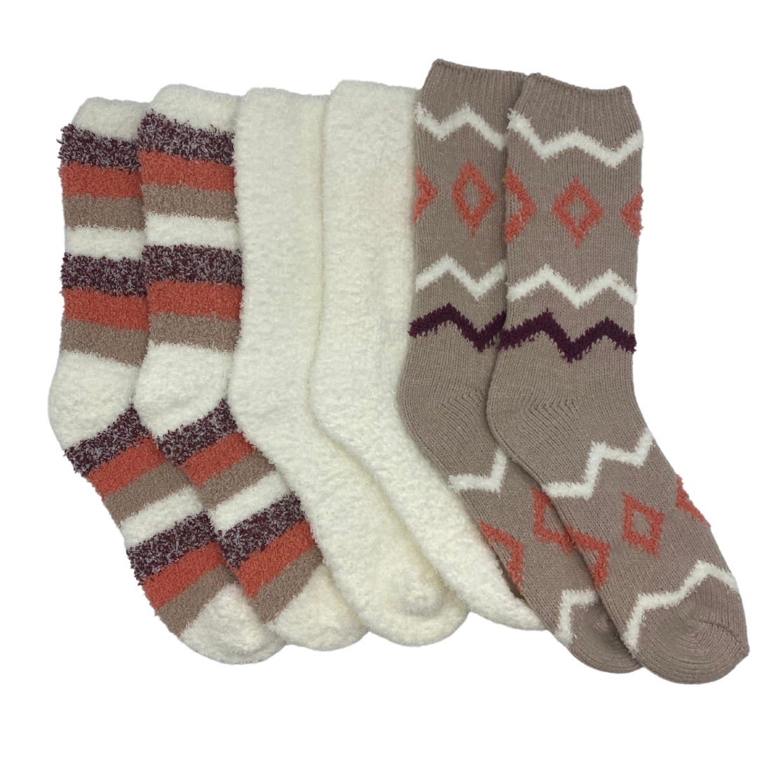 Three pairs of socks.

The first is a brown sock with white and dark brown zig zag stripes. The print also features a brown diamond shape pattern between the two white zig zag stripes.

The second is a plain beige sock.

The third consists of stripes in beige, dark brown, light brown, and reddish brown colors.