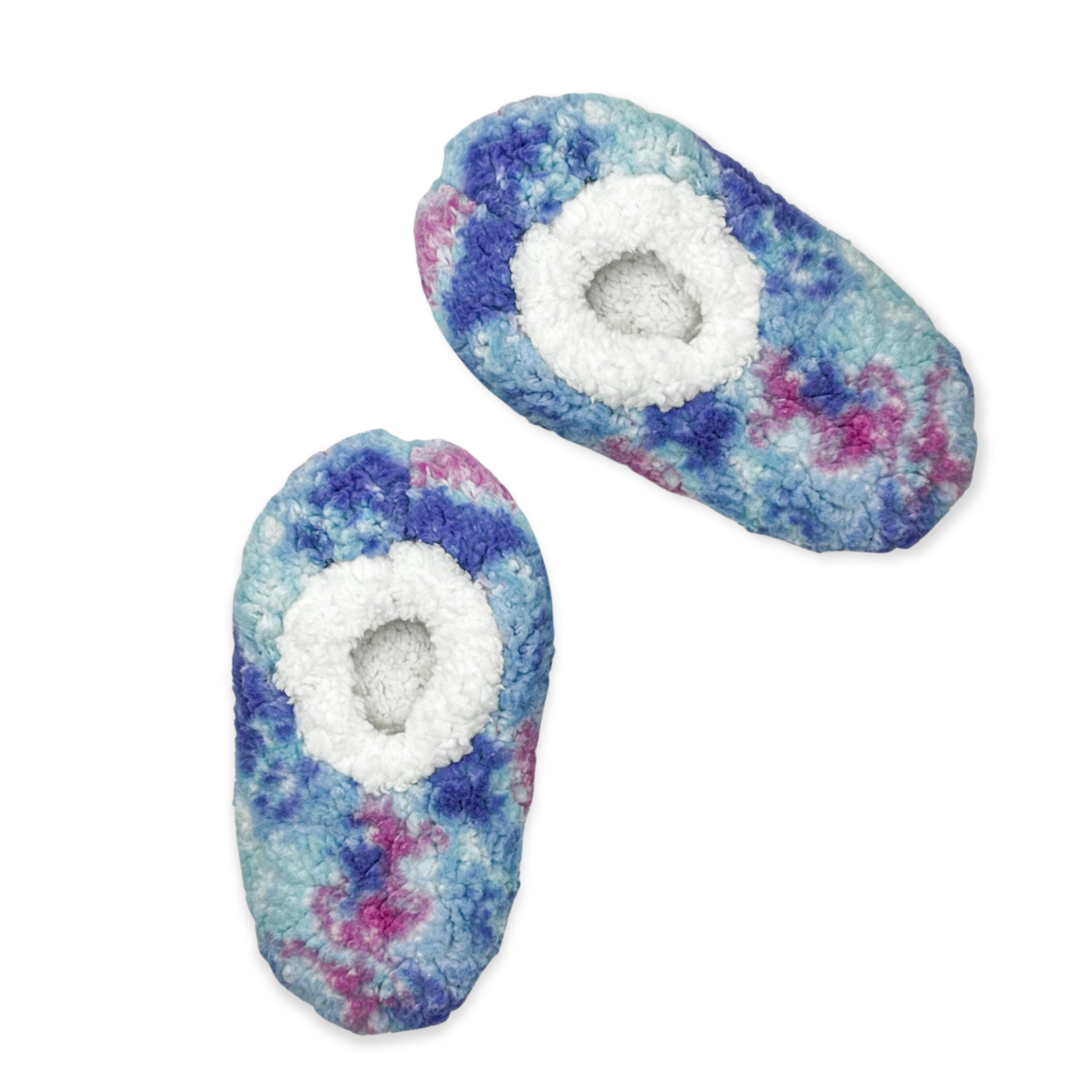 The image depicts a pair of galaxy tie dye slippers. The slippers are made of a soft, fuzzy material and have a closed toe design. They are perfect for keeping your feet warm and cozy on cold days.