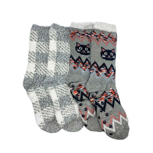 Two pairs of socks sitting next to each other. The socks are made of a soft, cozy material and are in the colors grey, black, white, and orange.

The left pair of socks are white and grey plaid, while the right pair have black, white, and orange zig zag lines with a cat face on the side.